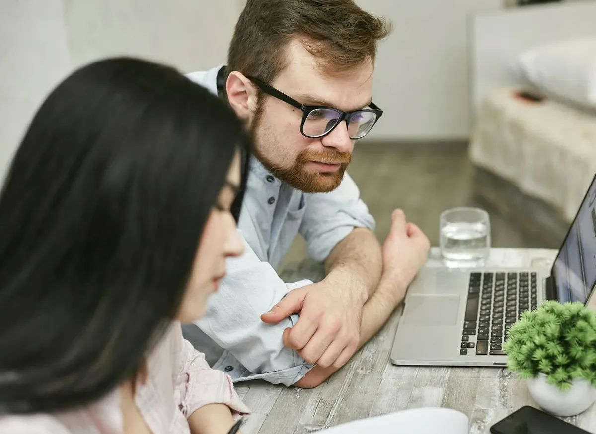 A small-business owner reviewing financing options at a desk