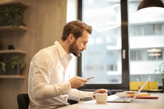 A business owner reviewing financing on the phone